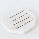 Gold & Black Beaded Star Lux Earrings